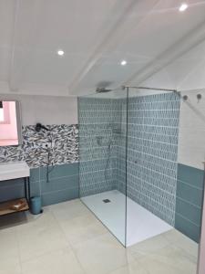 a bathroom with a shower with a glass door at Terra e Cielo Rooms in Parghelia +46 photos