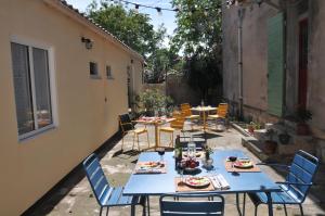 a group of tables and chairs on a patio at QG Marseille in Marseille +10 photos