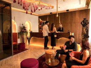 a group of people standing in a room at Alfons Boutique Hotel in Prague