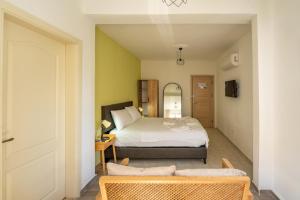 a bedroom with a bed and a couch in a room at NEV Fethiye in Fethiye +53 photos