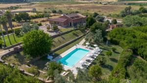 an aerial view of a house with a swimming pool at Al Palmento Country Hotel in Syracuse