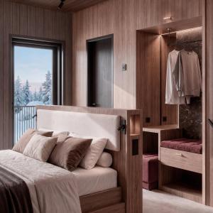 a bedroom with a bed and a walk in closet at SkyView Igloo Resort & Spa in Rovaniemi +62 photos