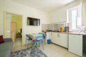 a kitchen with a table and chairs in a room at NEV Fethiye in Fethiye