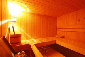 a wooden sauna with a light on the inside at Ospizio La Veduta in Bivio