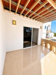 a view of a living room with a tile floor at Mar Real Suites Guayabitos in Rincon de Guayabitos +4 photos