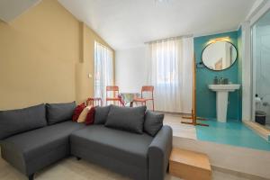 a living room with a couch and a table at NEV Fethiye in Fethiye