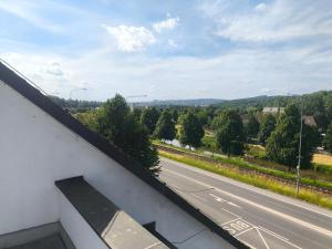 a view of a road from a balcony at Penzion-BelBar Zlín in Zlín