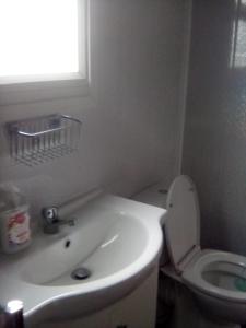 a white bathroom with a toilet and a sink at yeolde 2 bedroom Seashak Detached Cottage LOW 2026 PRICES NEWLY REFURBISHED PLUS FREE ALL ELECTRIC ENJOY in Bridlington