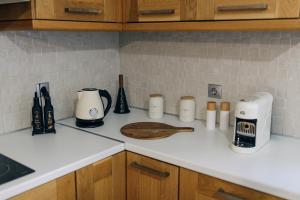 a kitchen counter with various items on it at Mesta Grand Residence in Chios