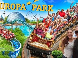 a group of people riding a roller coaster at a theme park at Schatzele in Boofzheim