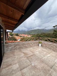a balcony with a view of a mountain at Refugio de Guacamayas in Mérida