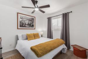 a bedroom with a bed with a ceiling fan at RUDRASAI 2611-Tempe,AZ in Tempe
