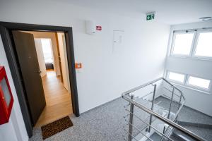 a room with a stair case and a door at Apartment 98A7 in Povljana