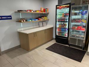 a store with a refrigerator and a counter with food at Holiday Inn Express Bluffton by IHG in Bluffton