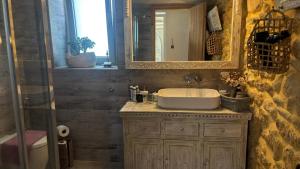 a bathroom with a sink and a mirror at Villa Katrinia in Sitia