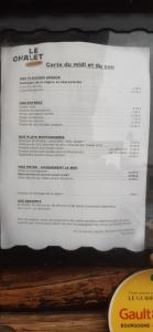 a menu for a steak restaurant sitting on a table at Le Chalet Lamoura Haut-Jura in Lamoura +1 photo
