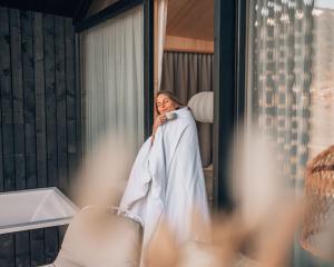 a bride taking a picture of herself in a mirror at Anton & Cilli Hideaway Lodges in Obermaiselstein