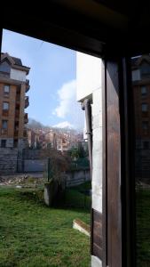 a window of a building with a view of a city at Apartmán Daniela in Bansko