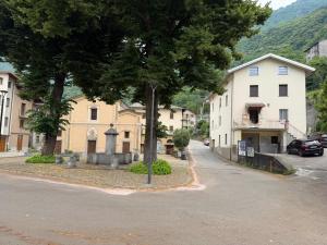 a street in a small town with houses and trees at Bellavista-Verceia in Verceia +10 photos