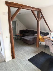 a living room with a couch and a table at Modernes Landhaus Modern country house in Kalkar
