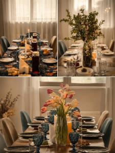 ein langer Tisch mit Tellern und Blumenvasen in der Unterkunft Hotel Axien Kazbegi in Kazbegi