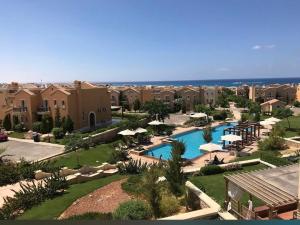 an aerial view of a resort with a swimming pool at Mountain View luxe chalet Ras elhikma families only in Ras Elhekma