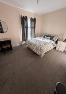 a bedroom with a bed and a window at Cosy Heavens in Quinton +11 photos