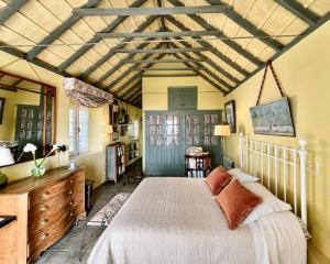 a bedroom with a white bed in a room at Cortijo La Hoya in El Bujeo +31 photos