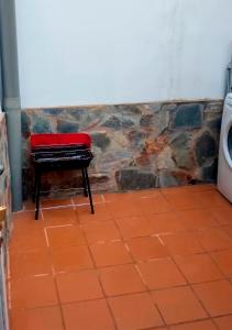 a piano sitting in a bathroom next to a toilet at Ruralux Aroche in Aroche