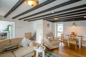 a living room with a couch and a table at 2 Bed in Pwllheli oc-44492 in Nefyn