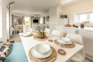 a kitchen and dining room with a table and chairs at 2 Bed in St. Minver oc-r29475 in Saint Minver