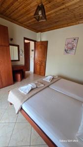 a large bed in a room with at studios ELENA in Potos +104 photos