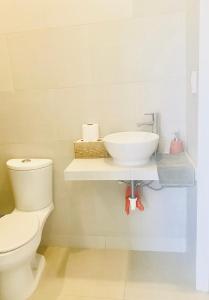 a bathroom with a sink and a toilet at Studio Cangrejos in Los Médanos Partidos