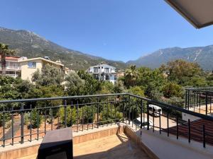 a balcony of a house with mountains in the background at Olivra Apart in Cedit