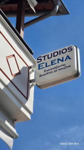 a sign on the side of a building at studios ELENA in Potos