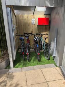 a group of bikes parked in a garage at Domus26 chambre Meridional in Montaigu-Vendée