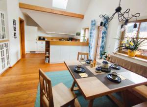 a kitchen and dining room with a table and chairs at Honigduft und Bienenluft in Sankt Oswald bei Freistadt