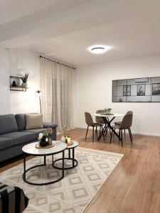a living room with a couch and a table at Panorama Krizevac in Međugorje