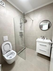 a bathroom with a shower and a toilet and a sink at Panorama Krizevac in Međugorje +75 photos