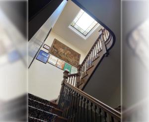 a spiral staircase with a skylight in a house at Fenway Park Brownstone in Boston