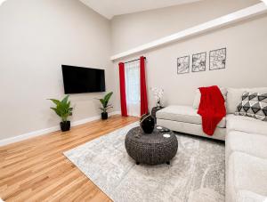 a living room with a couch and a tv at Private 1BR Apt, WiFi, Reliable, Near NYC in Scotch Plains