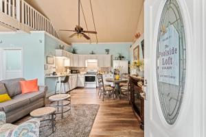a living room and kitchen with a couch and a table at The Poolside Studio - Lounge Pool Wifi in Jacksonville