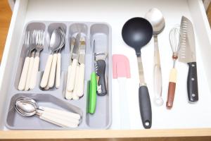 a drawer filled with utensils in a tray at Starview by MD apartments in Ljubljana +25 photos