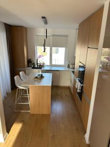 a kitchen with a table and chairs in a room at Paradise Relax in Zalău +3 photos