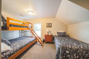a bedroom with two bunk beds and a ladder at The Berlin Guesthouse in Millersburg