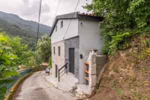 a small white building on the side of a hill at Villa Jeronimo`s in Geres