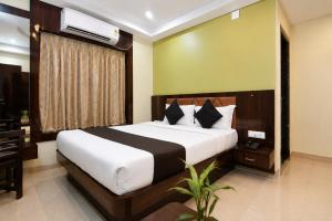 a bedroom with a large bed and a desk at The Fortune Hotel, Newtown in New Town