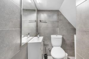 a bathroom with a toilet and a sink at Villa Jeronimo`s in Geres +24 photos