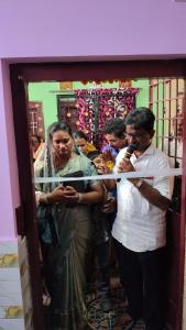 a man and a woman standing in a doorway at Peddanna House Complex in Vijayawāda