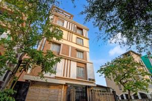 a tall building with trees in front of it at The Fortune Hotel, Newtown in New Town